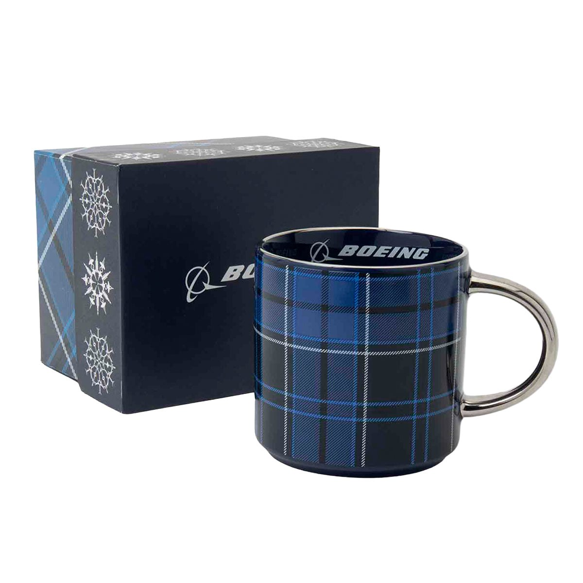Blue plaid Boeing Tartan 2026 Jet Snowflake Ceramic Mug with a silver handle, shown next to its matching gift box decorated with a snowflake design.