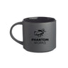 The Boeing Phantom Works Ceramic Matte Mug by BOEING features a matte gray ceramic exterior with a black interior and showcases a stylized figure in a hat and trench coat above the PHANTOM WORKS text, making it an ideal aerospace gift for Boeing fans.