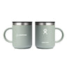 Two green insulated Hydroflask Boeing Coffee Mugs by The Boeing Store are displayed side by side. The left mug has a Boeing logo, and the right features a Hydro Flask logo with TempShield™ insulation. Both mugs come with black lids and offer a minimalist design ideal for coffee lovers.