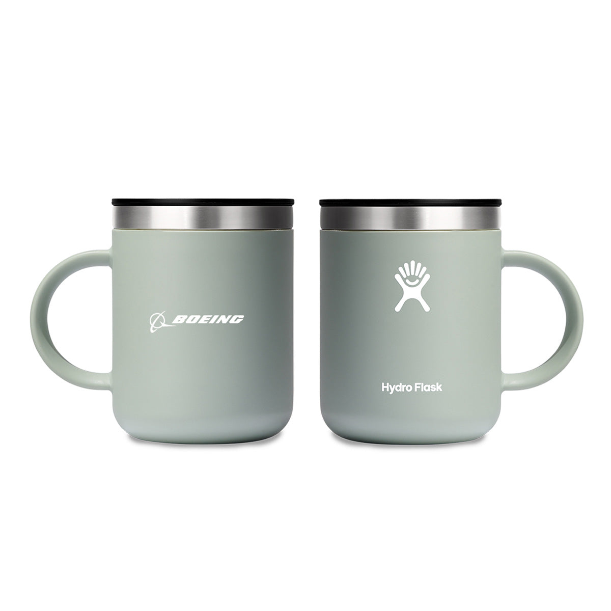 Two green insulated Hydroflask Boeing Coffee Mugs by The Boeing Store are displayed side by side. The left mug has a Boeing logo, and the right features a Hydro Flask logo with TempShield™ insulation. Both mugs come with black lids and offer a minimalist design ideal for coffee lovers.