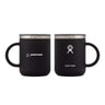 The Hydroflask Boeing Coffee Mug from The Boeing Store includes two black, stainless steel insulated mugs with handles and metallic rims. The left mug displays the Boeing logo, while the right features the Hydro Flask logo and boasts TempShield™ insulation technology.