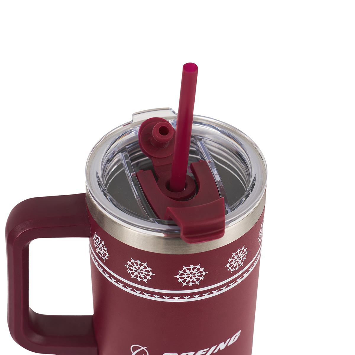 The BOEING 2025 Jet Snowflake 30oz Tumbler is a maroon travel mug with a handle, white snowflake patterns, a clear lid with an open flip-top spout, and a matching maroon straw inserted in the lid.