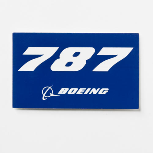 BOEING 787 Dreamliner Sticker: A blue rectangular sticker with the bold white 787 above the iconic Boeing logo featuring a stylized ring and arrow. Perfect for any 787 Dreamliner enthusiast.