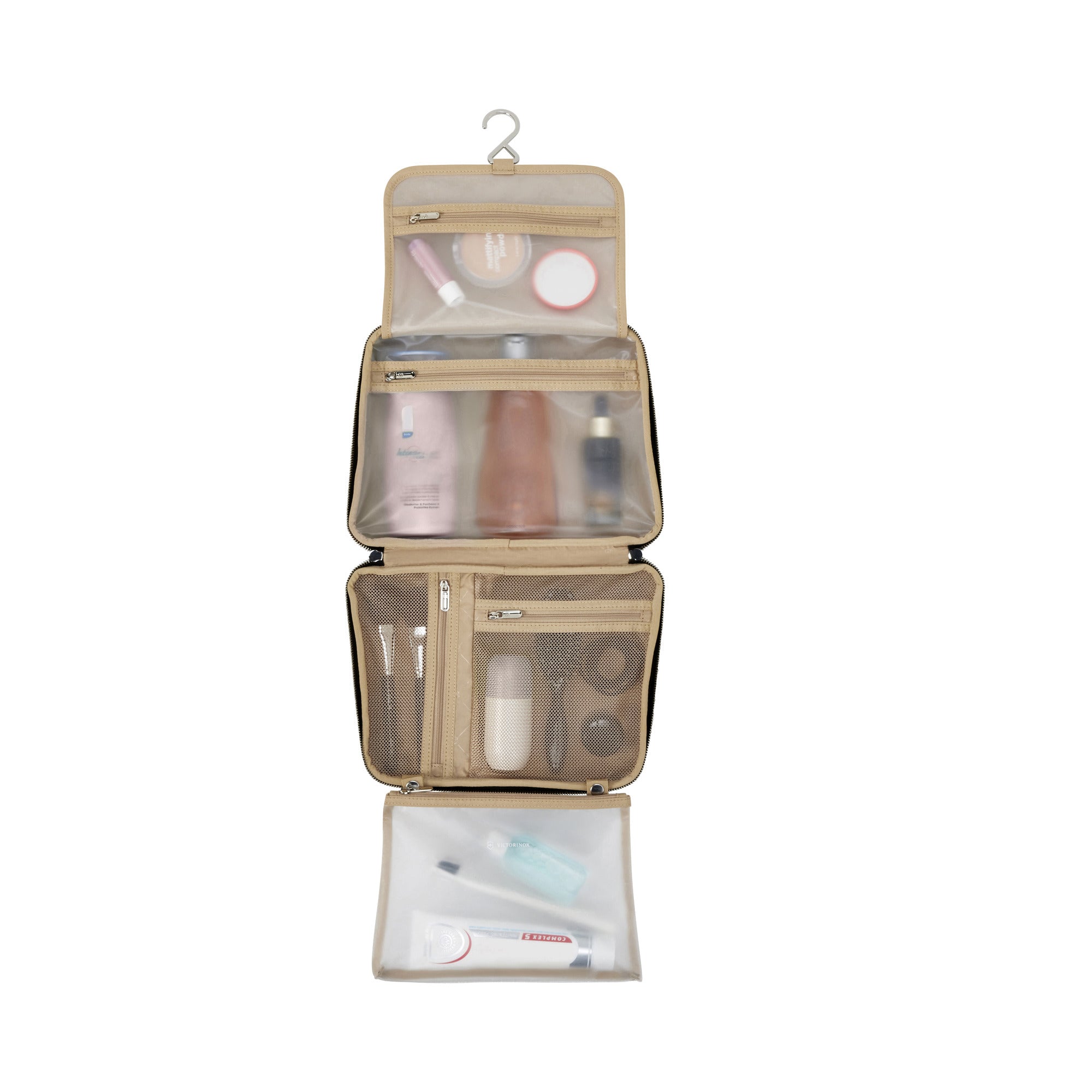 The Victorinox Victoria Signature Beauty Case by VICTORINOX is a beige hanging toiletry bag featuring an odor-resistant lining and hook. It has three zippered compartments displaying organized toiletries like bottles, tubes, and brushes when open.