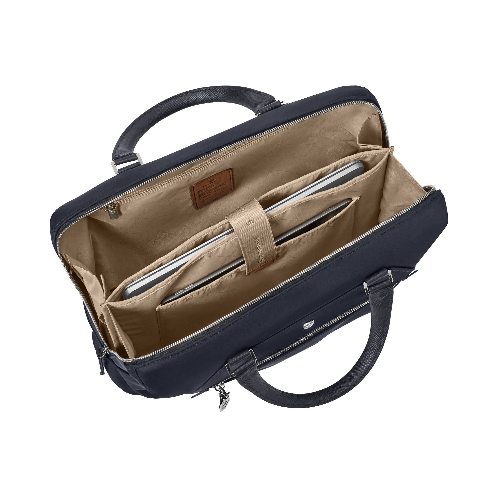 Open the Victorinox Victoria Signature Briefcase by VICTORINOX to reveal a beige interior. With cushioned leather handles, it has two compartments for silver laptops and a removable pouch, ensuring safe transport of electronics.