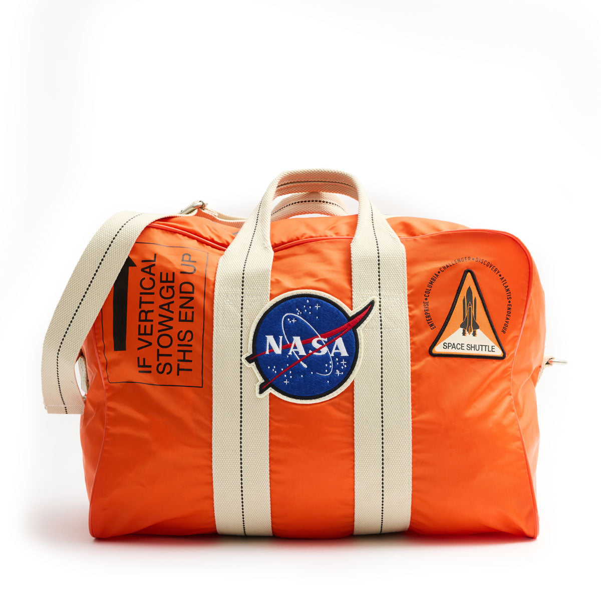 Orange NASA-themed bag with white straps, featuring NASA and Space Shuttle patches. Marked with "IF VERTICAL STOWAGE THIS END UP." Rugged and adventurous.