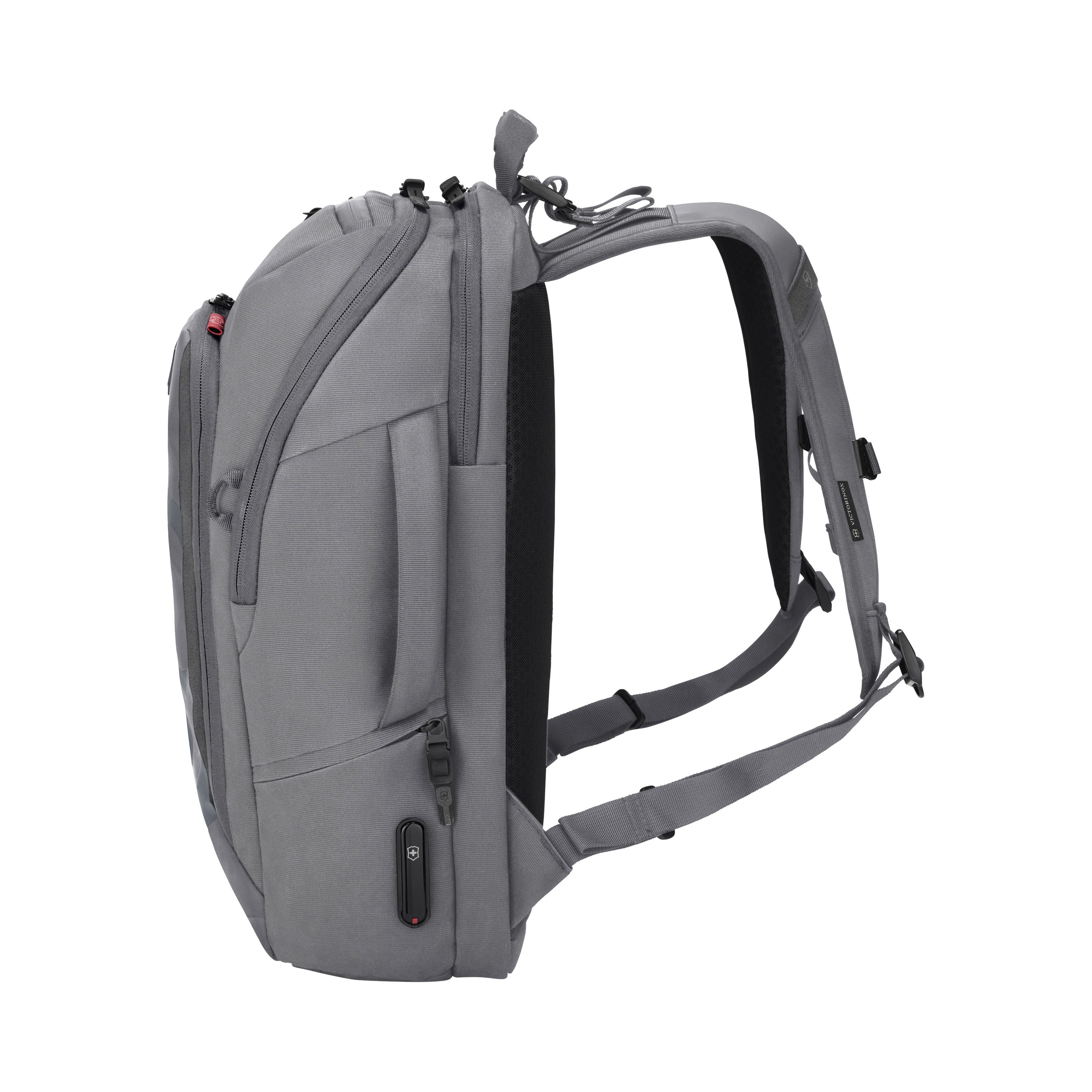 The Victorinox Touring 2.0 Commuter Backpack by VICTORINOX is shown from the side in gray with water-resistant material and multiple compartments, including a concealed pocket. Padded shoulder straps add comfort, and a USB port on the side boosts functionality, all positioned upright on a white background.