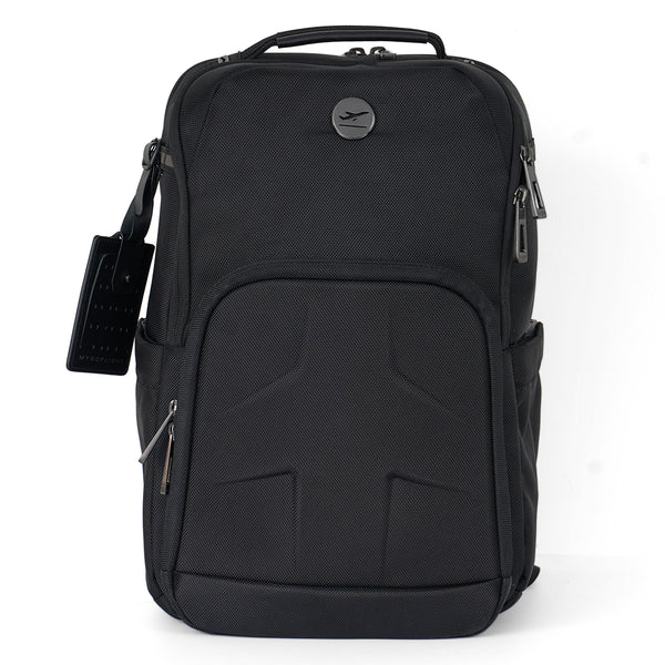 The BOEING MyGoFlight Elevate Bag is a black ballistic nylon flight bag with multiple zippered compartments, top handle, side pockets, and a luggage tag. It features a subtle textured front and a small round logo near the top.