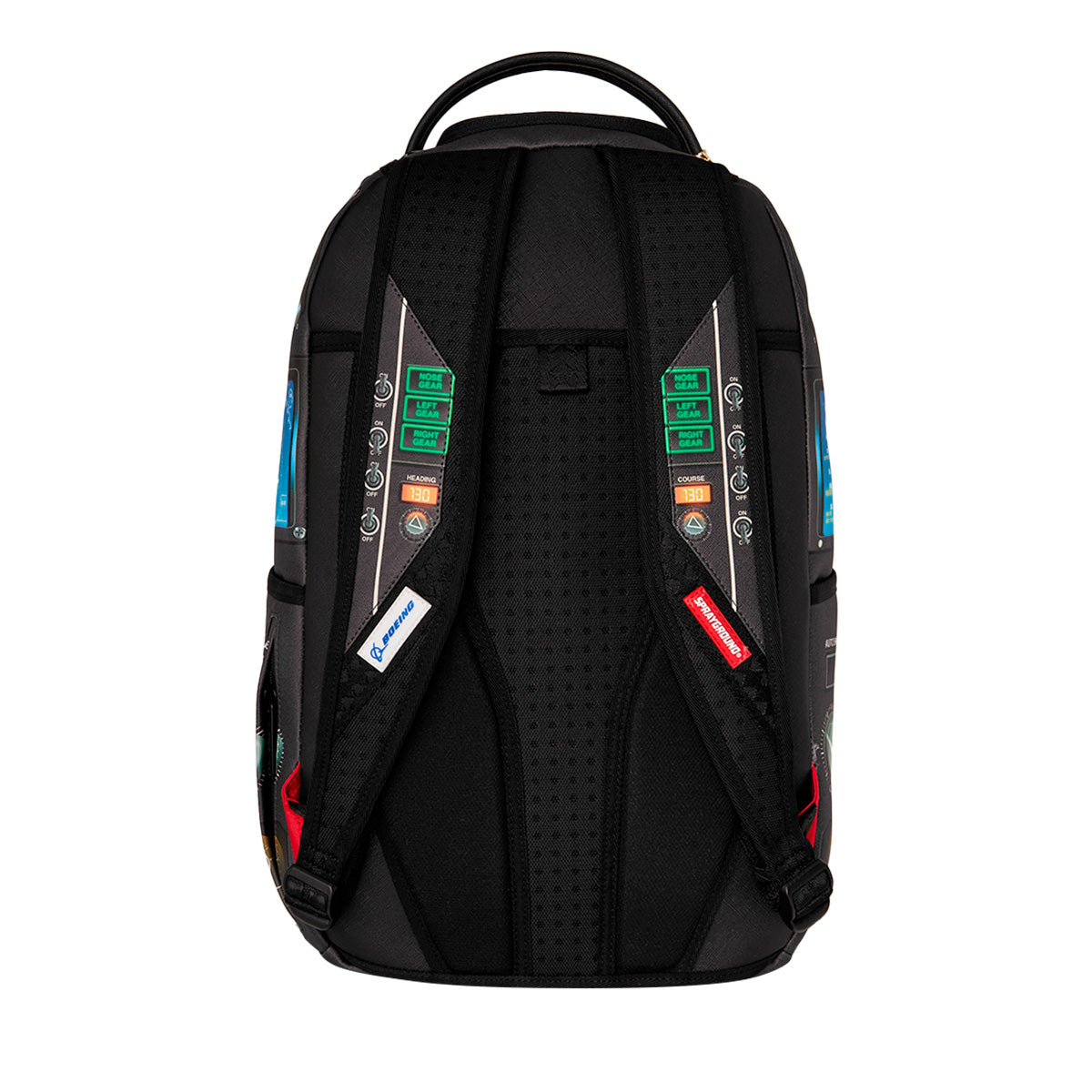 The BOEING Sprayground F/A-18 Super Hornet DLXSR Backpack is shown from the back, featuring padded shoulder straps adorned with colorful rectangular patches and labels, as well as a top handle. Inspired by the iconic F/A-18 Super Hornet, this carry-on backpack combines a modern, tech-inspired design with a dedicated laptop compartment for added convenience and security.