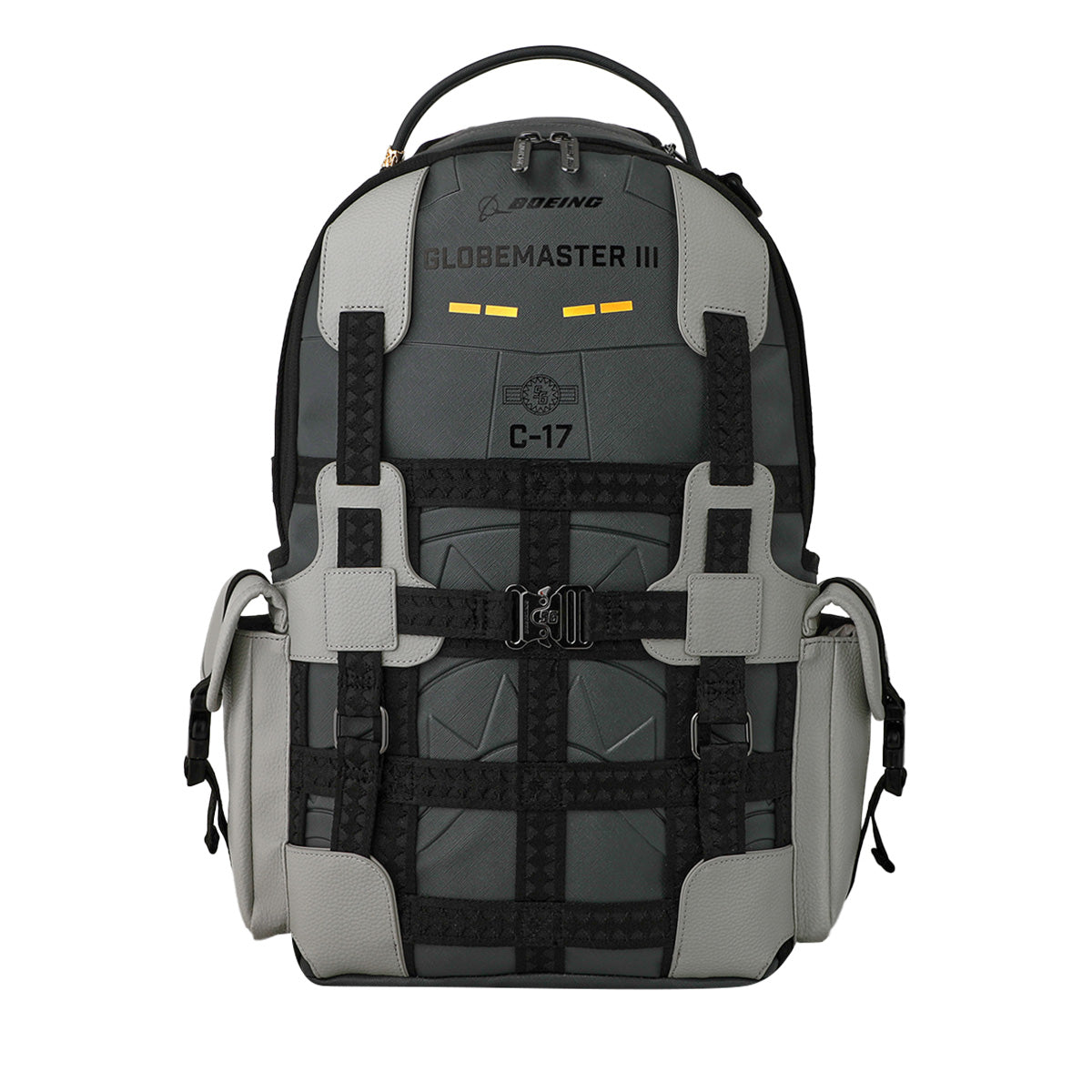 The Sprayground Boeing C-17 Globemaster DLXSV Backpack by BOEING is a black and gray, aviation-inspired backpack featuring “GLOBEMASTER III” and “C-17” text, side pockets, a top handle, and decorative straps—capturing military style in true Sprayground fashion.