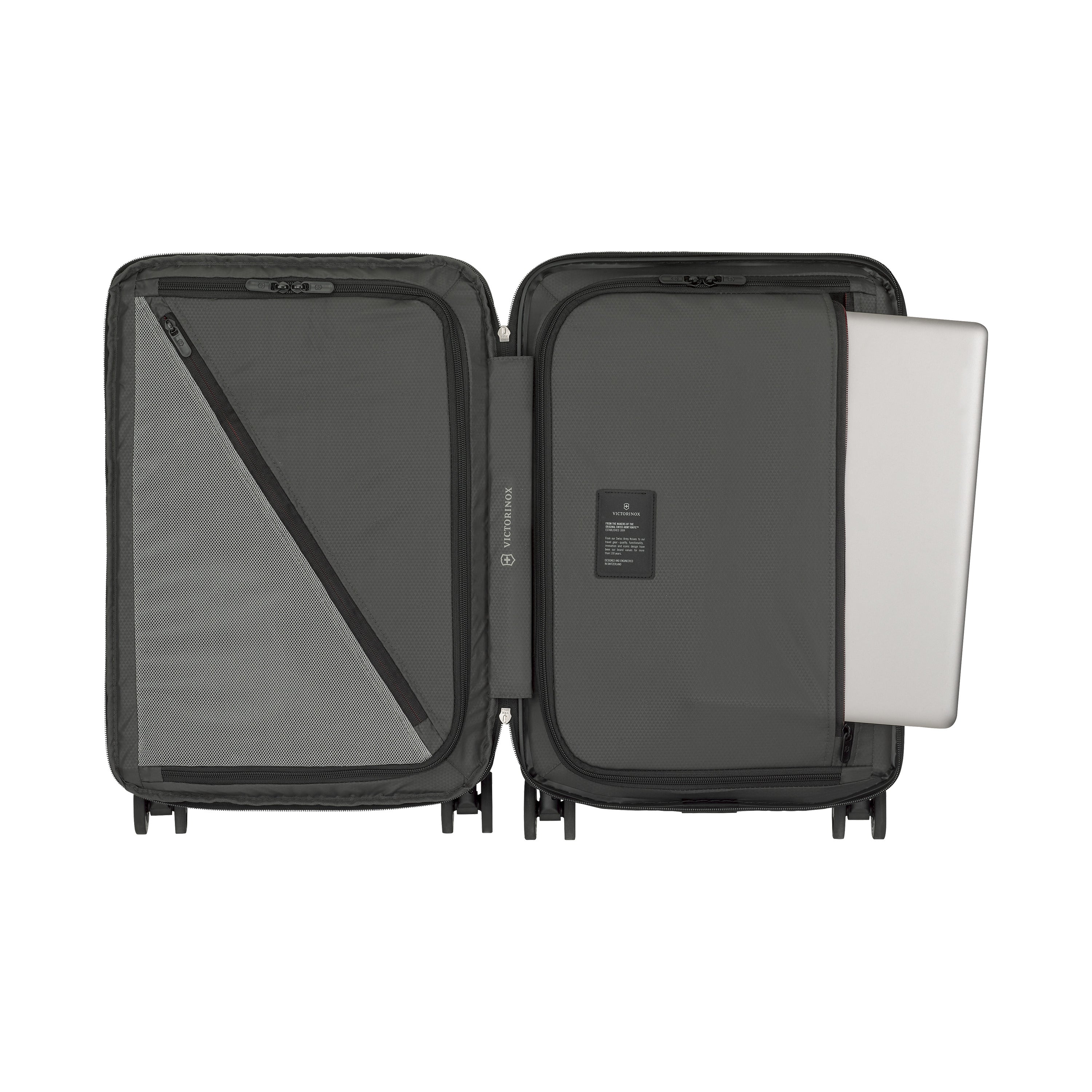 The Victorinox Airox Advanced Frequent Flyer Carry-on in black reveals organized compartments. The left side has a mesh pocket with a diagonal zipper, while the right holds a flat compartment for a laptop. Its sleek gray fabric lining adds style to this lightweight VICTORINOX travel design.