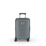 The Victorinox Airox Advanced Frequent Flyer Carry-on - Storm is a sleek, gray, hard-shell suitcase with a grooved design. It features VICTORINOX branding, four dual caster wheels, a telescopic handle, and a distinctive logo.