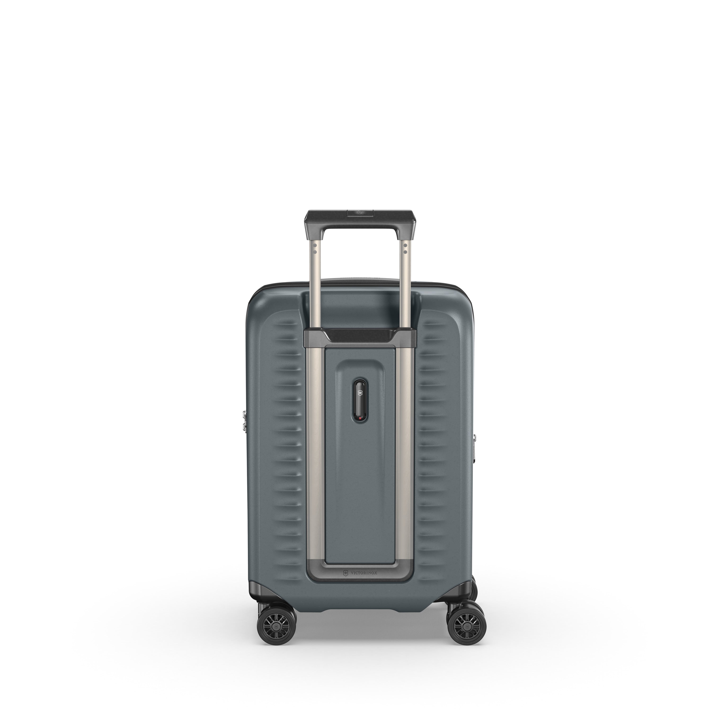 The Victorinox Airox Advanced Frequent Flyer Carry-on - Storm by VICTORINOX features dual caster wheels, a sturdy gray hard shell with ribbed sides, an extendable retractable handle, and a secure front lock. It is showcased against a plain white background.