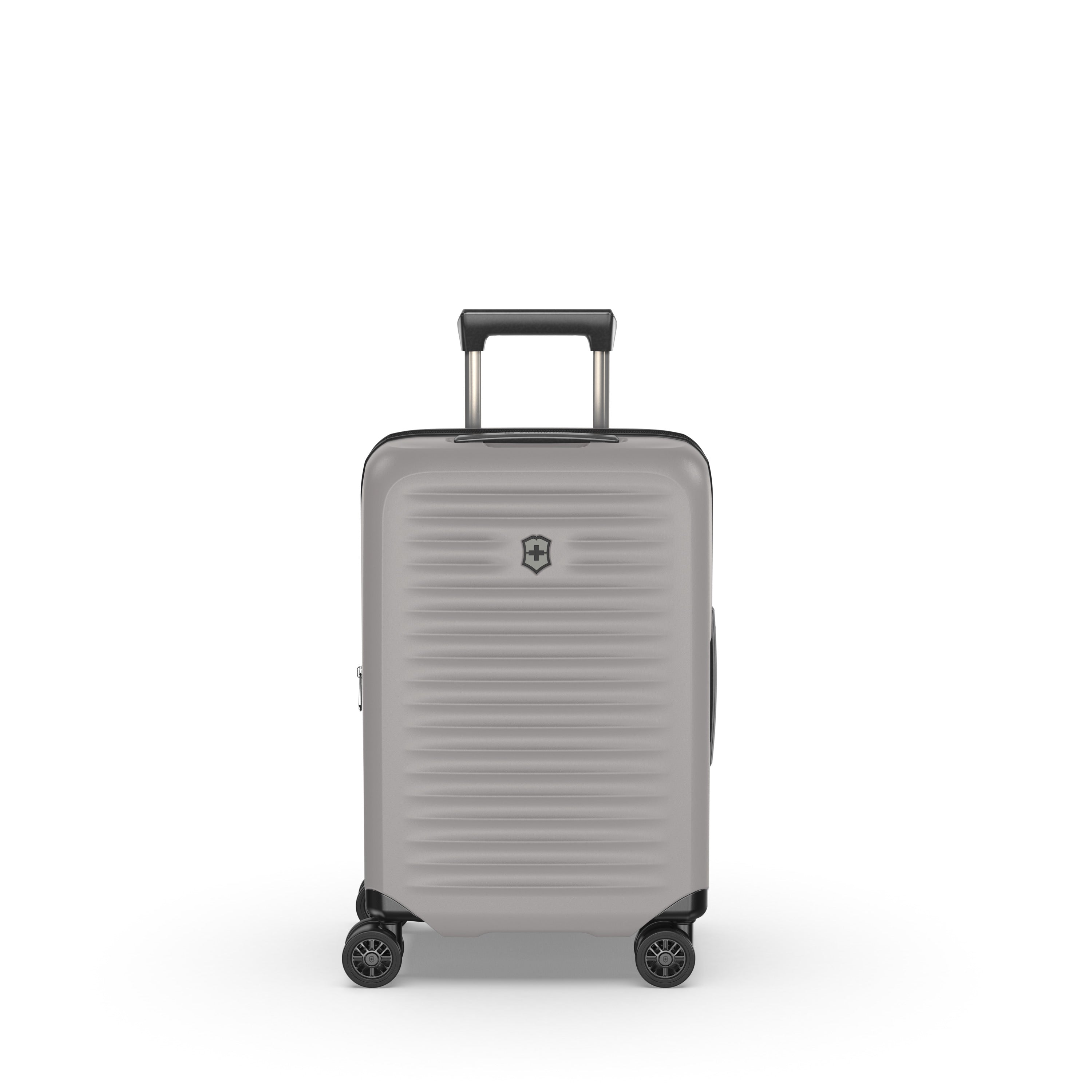 The Victorinox Airox Advanced Frequent Flyer Carry-on in Stone features a sleek silver hard-shell design with textured surface, four black swivel wheels, and a telescopic handle. The VICTORINOX logo is proudly displayed on the front, echoing Swiss craftsmanship.