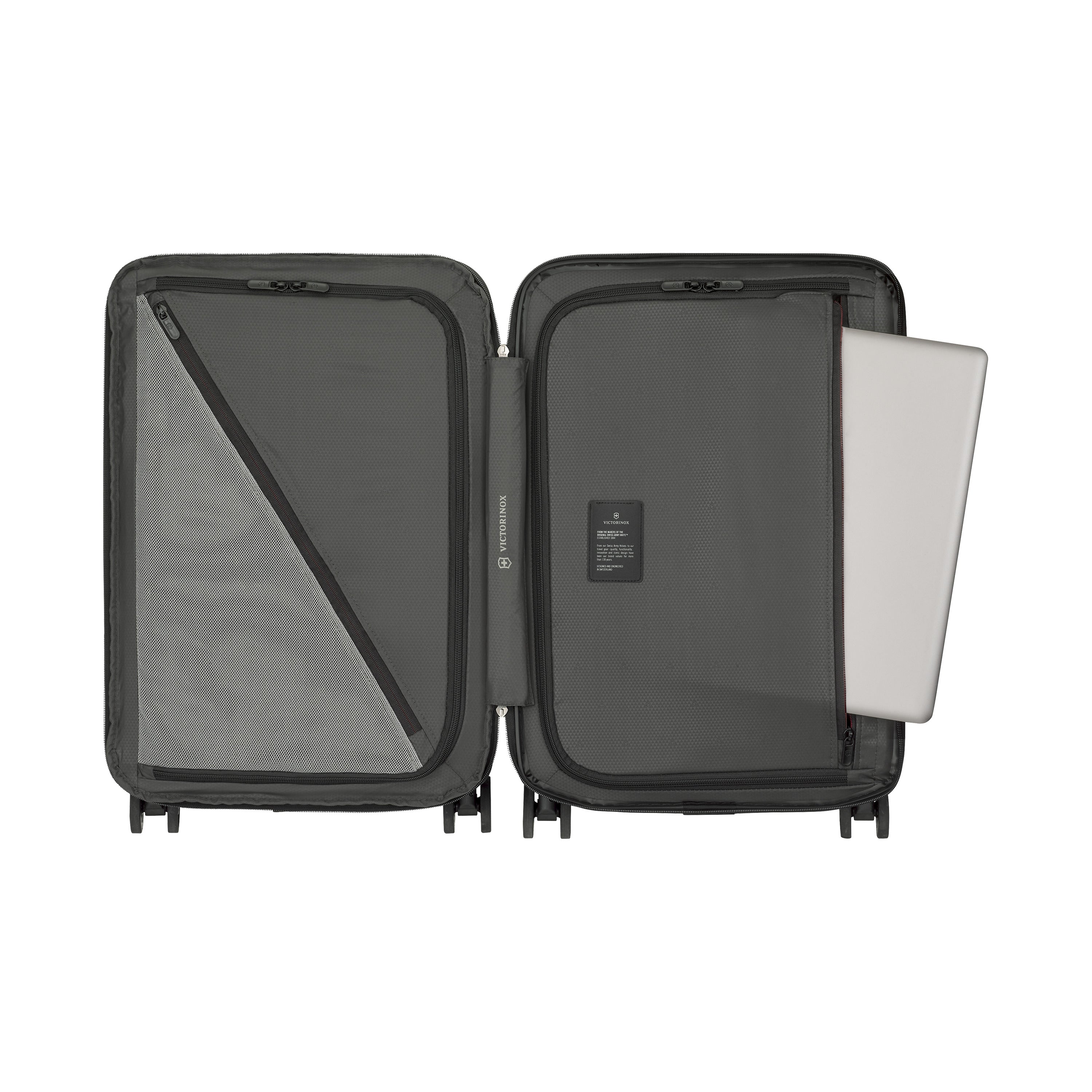The Victorinox Airox Advanced Frequent Flyer Carry-on Plus in Black by VICTORINOX features minimalist design and lightweight build. Inside, find a mesh zippered pocket on the left and a large sleeve for your laptop on the right, all in neutral gray. Ideal for frequent flyers.