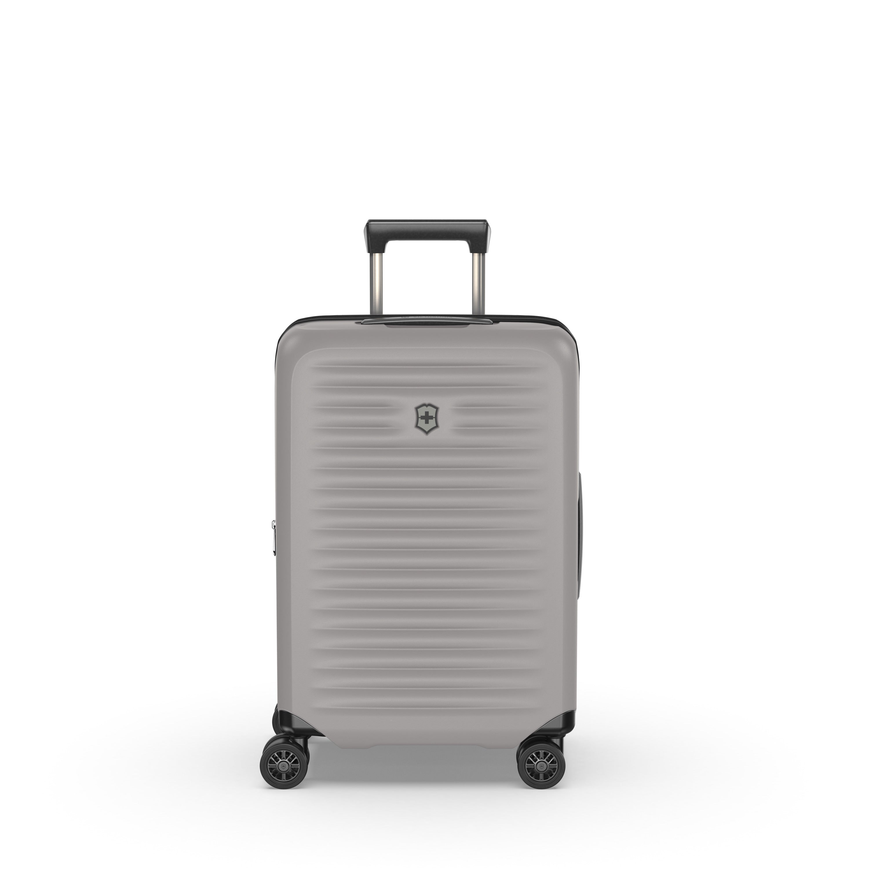 The VICTORINOX Airox Advanced Frequent Flyer Carry-on Plus in Stone is a hard-shell suitcase with Dual Caster Wheels and a retractable handle, combining lightweight design with horizontal ridges and a small top-center shield logo for stylish functionality.
