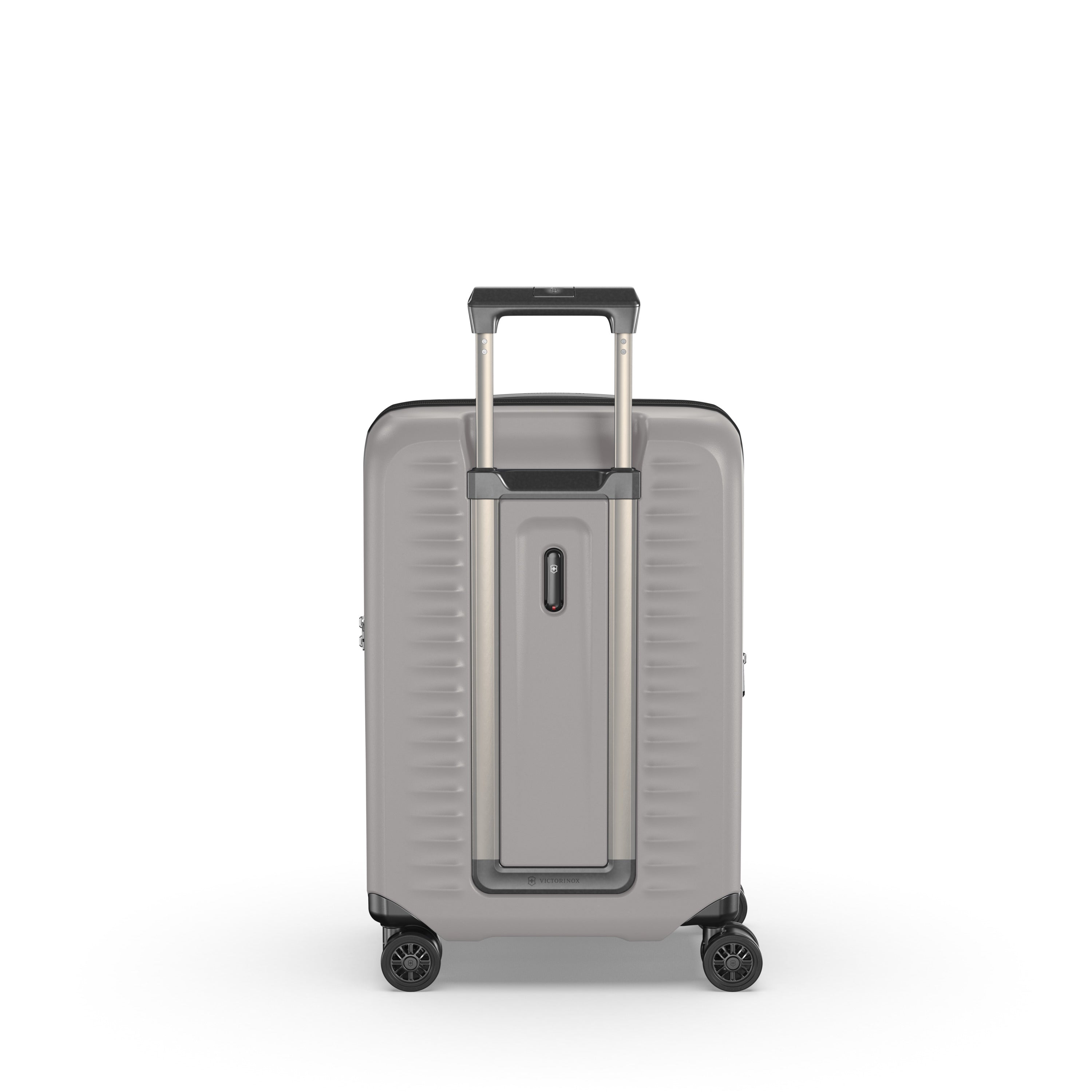 The Victorinox Airox Advanced Frequent Flyer Carry-on Plus in Stone is a lightweight, gray hard-shell suitcase with a telescopic handle and Dual Caster Wheel System for easy mobility. Its textured surface has horizontal grooves and a central rectangular accent, combining style with practicality.