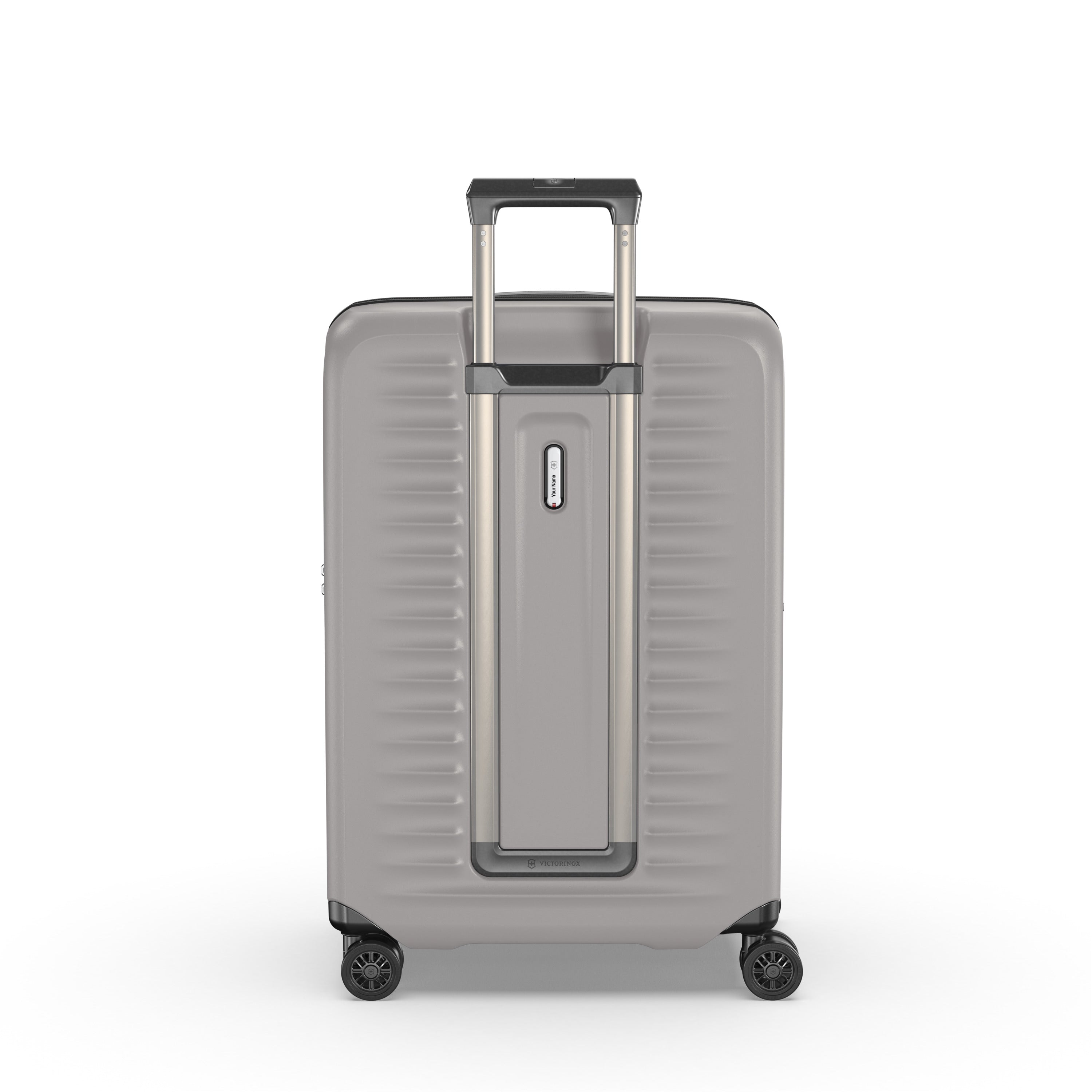 The Victorinox Airox Advanced Medium - Stone by VICTORINOX is a large, silver suitcase with a lightweight design. It features a telescopic handle, four black wheels, a horizontally ribbed surface, and a built-in front lock.