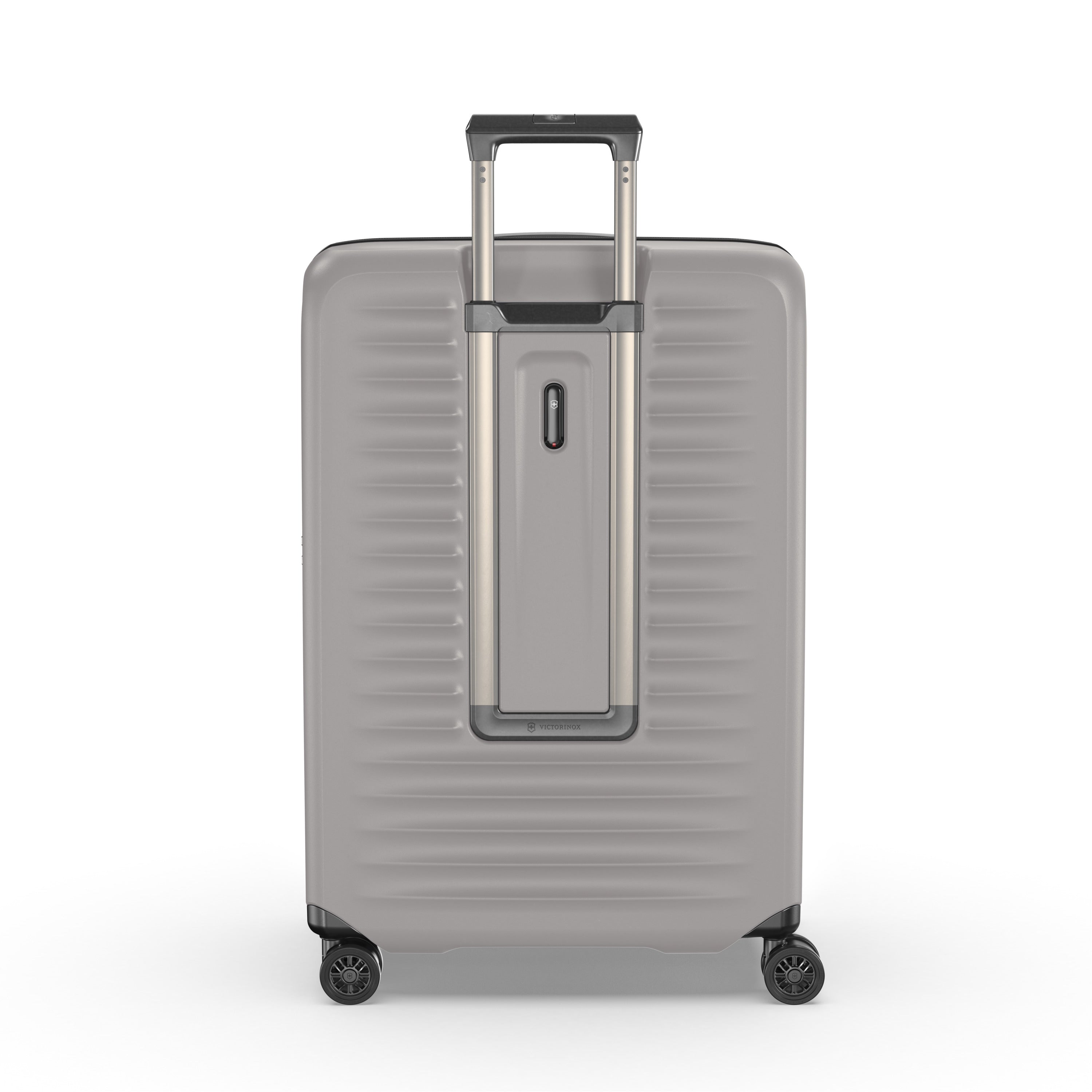 The Victorinox Airox Advanced Large - Stone by VICTORINOX is a lightweight silver suitcase featuring a hard shell with horizontal ridges, a telescoping handle, four wheels, and a vertical protective strip. Its interior is anti-microbial for added peace of mind.