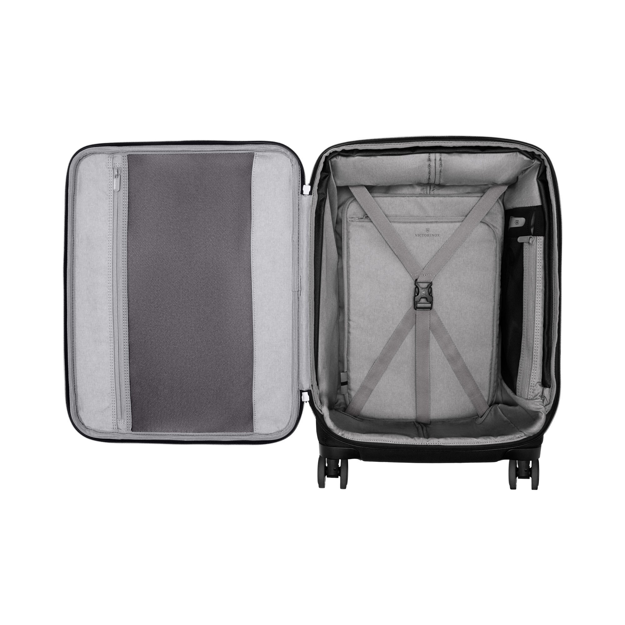 The Victorinox Werks 6.0 Frequent Flyer Plus Carry-on by VICTORINOX showcases an open black suitcase on a white background, featuring a gray interior lining, dual compartments—left with mesh zip pocket, right with cross straps—and dual caster wheels for easy mobility and upright standing.