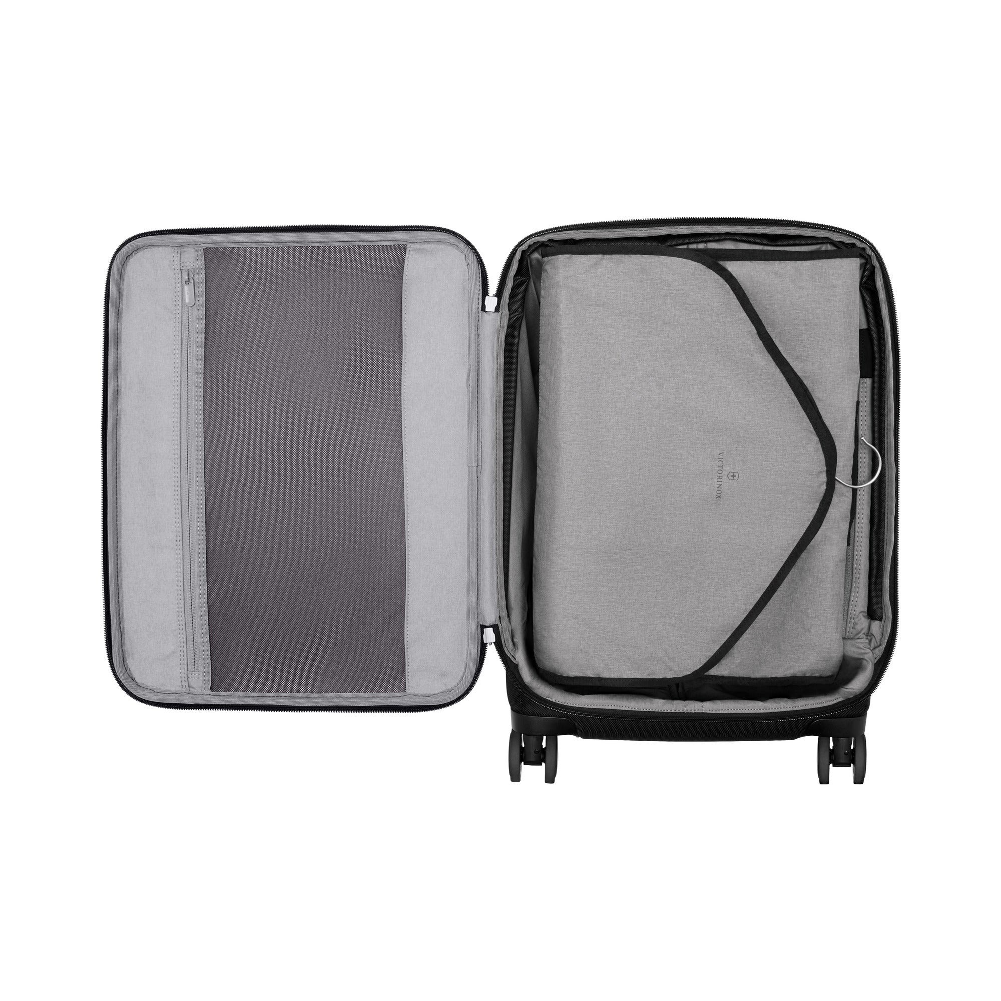 The Victorinox Werks 6.0 Frequent Flyer Plus Carry-on by VICTORINOX features an open black design with a divided interior, including a left zippered mesh compartment and a right fabric flap with buckle strap. It sits elegantly on dual caster wheels against a white background.