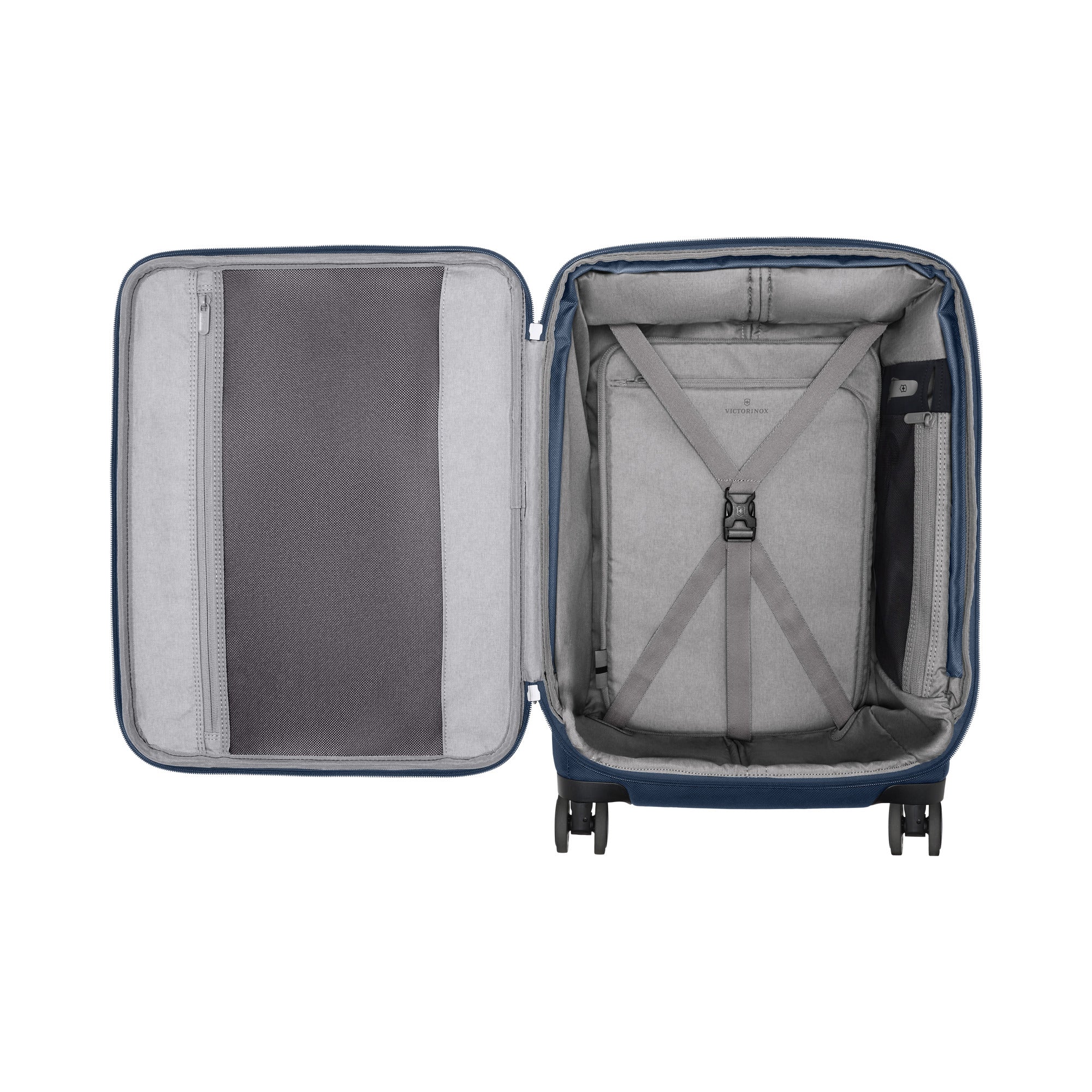 The Victorinox Werks 6.0 Frequent Flyer Plus Carry-on, by VICTORINOX, is a blue suitcase with a grey interior featuring two compartments: a left zippered mesh pocket and right elastic cross-straps. It has dual caster wheels for smooth mobility and includes a TSA lock for added security.