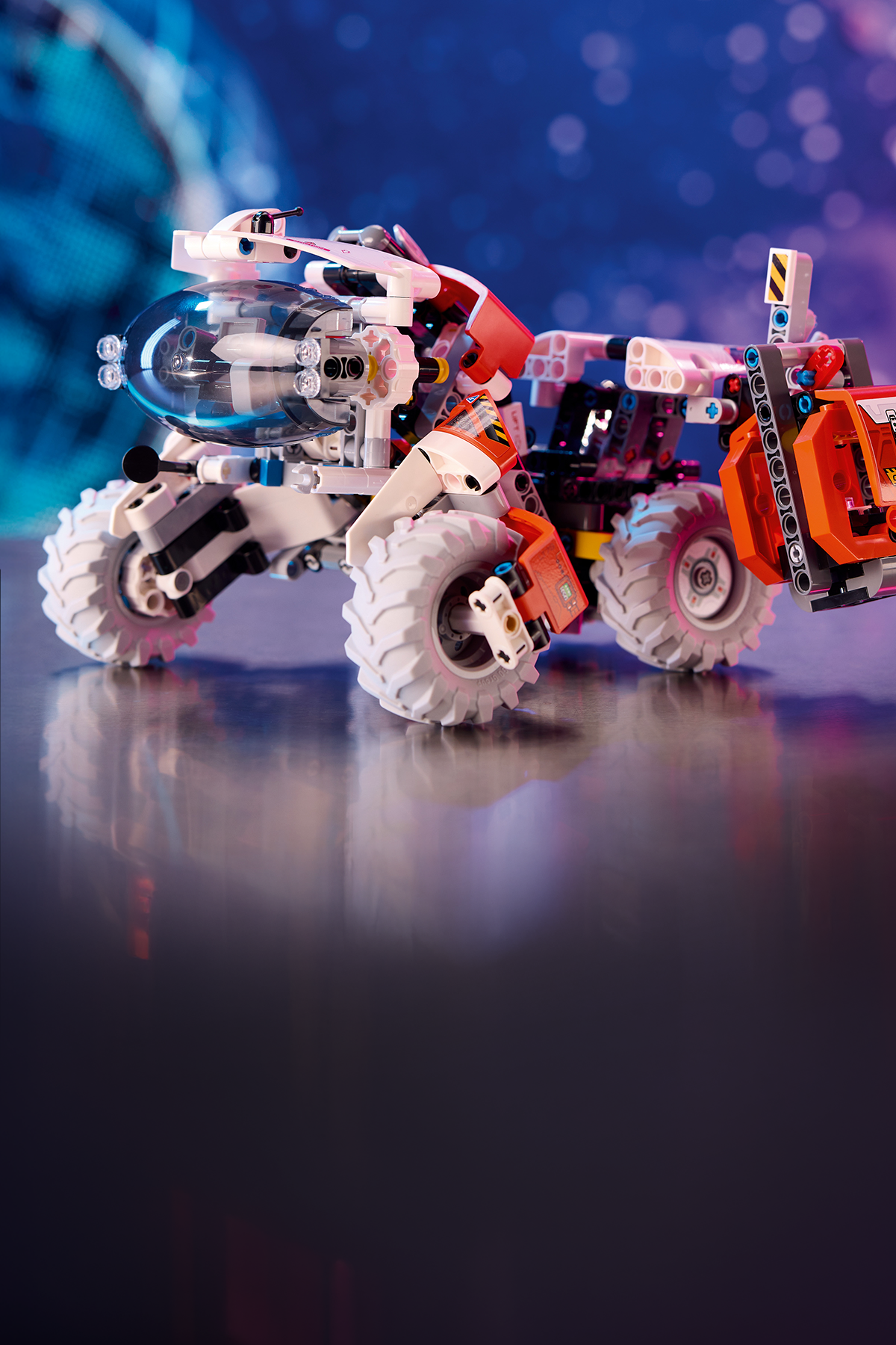 Mobile hero banner for STEM Toys featuring the LEGO Surface Space Loader building set on a blurred purple background. Links to the STEM Toys collection page.