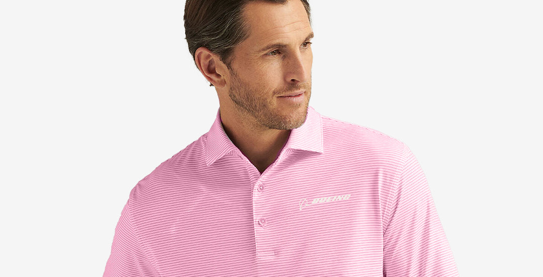A light pink striped polo shirt with the Boeing logo embroidered on the chest.