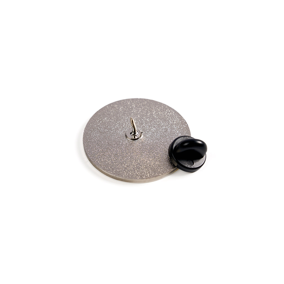 A textured, round Boeing Space Launch System Skyward Lapel Pin lay face down on a white background with its matte black rubber clutch nearby. The pin boasts a smooth, shiny finish that captures the essence of aviation flair.