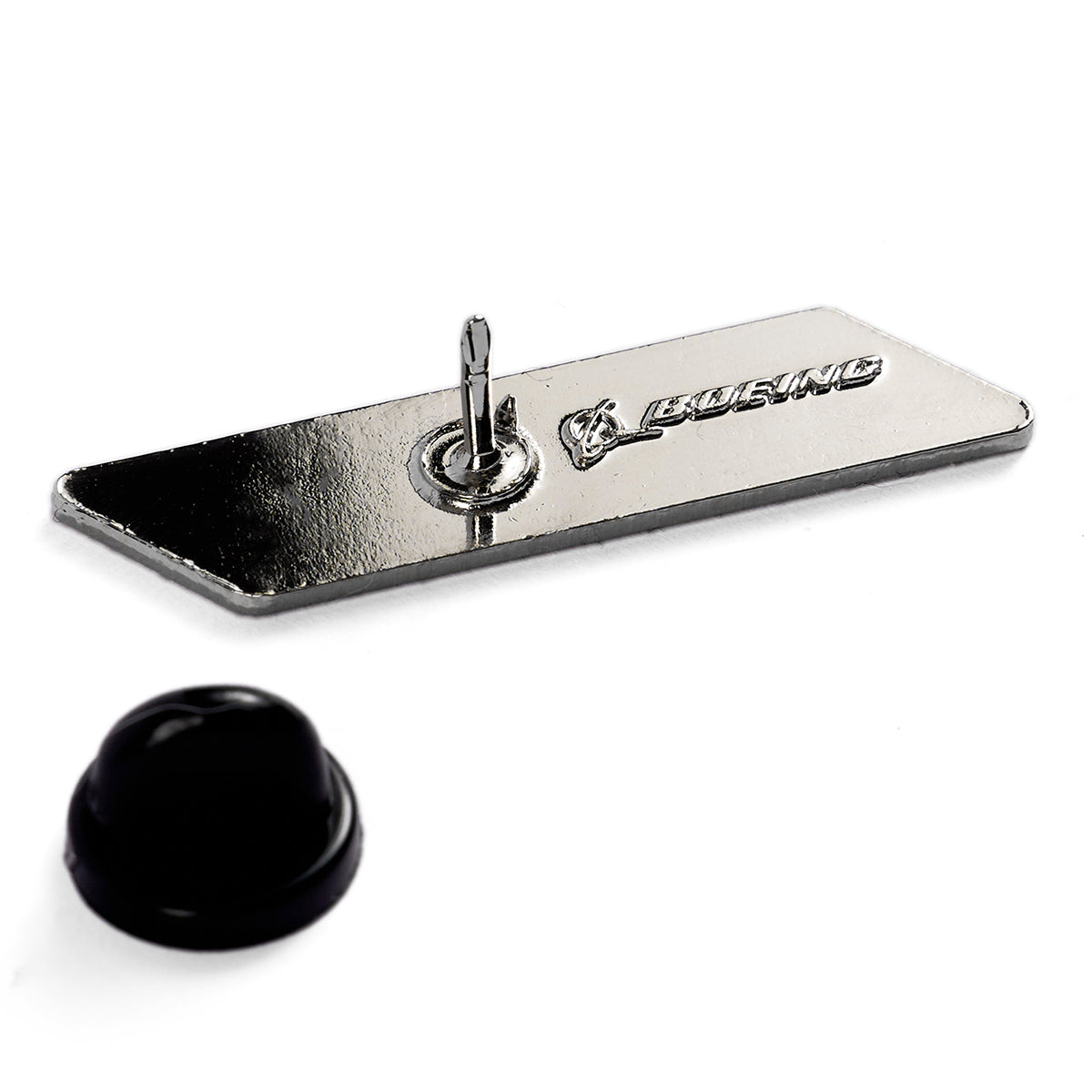 The Boeing C-17 Globemaster Velocity Lapel Pin is a rectangular metal pin with an engraved Boeing, ideal for aviation enthusiasts. It features a reflective surface, needle back, and includes a black plastic cap for secure fastening.