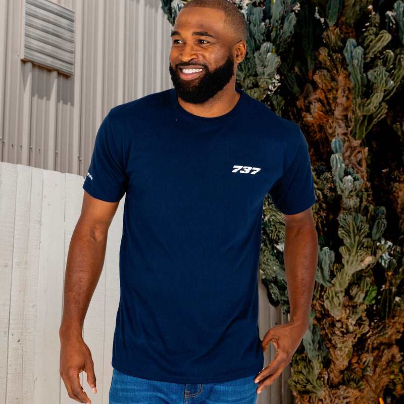 Man wearing a navy blue t-shirt with the Boeing 737 Stratotype logo.