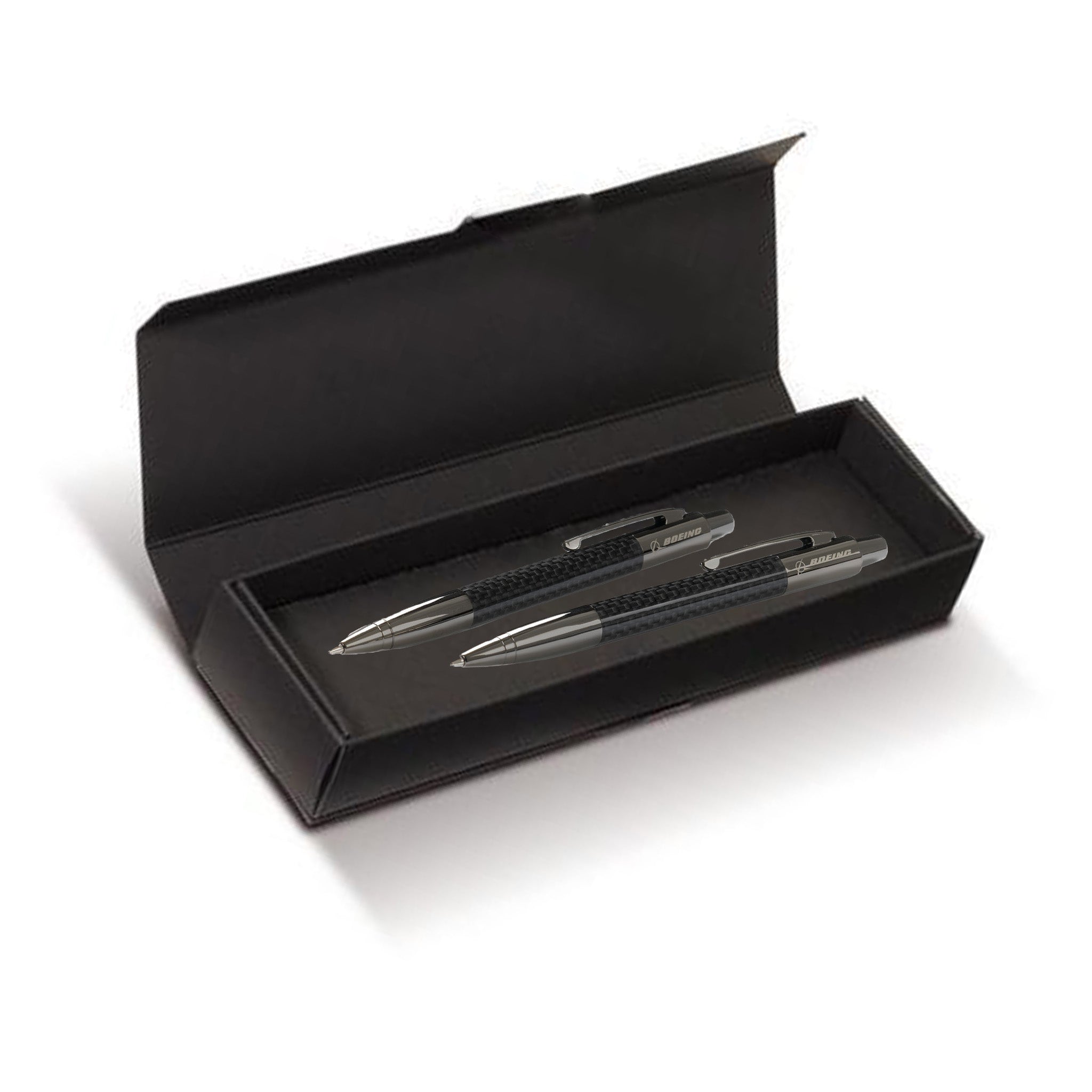 The Boeing Stores sleek gift box reveals the sophisticated Boeing Stealth Carbon Fiber Pen/Pencil Set, featuring silver and black accents. This elegant duo is displayed open against a pristine white background.