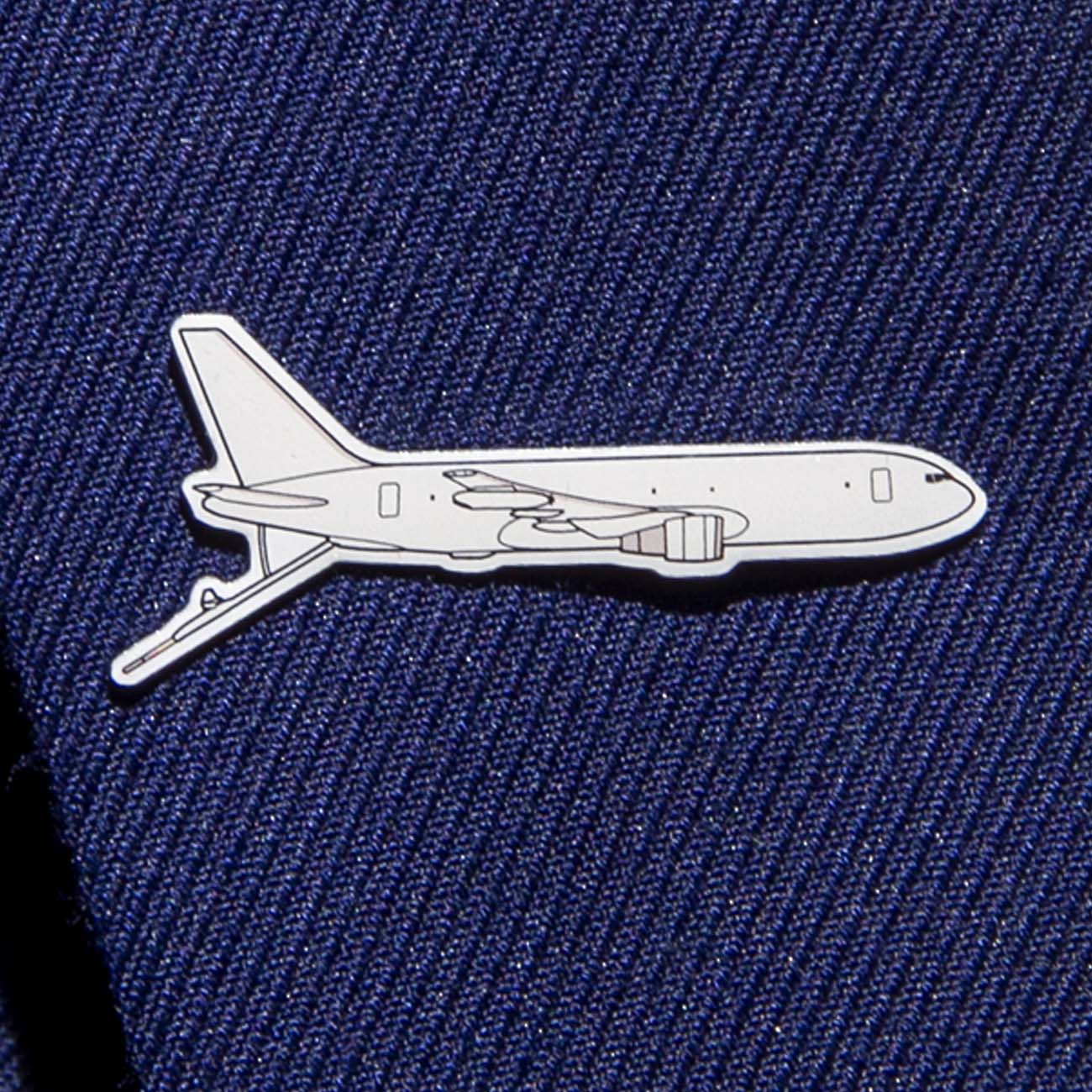 The Boeing Stores Boeing Illustrated KC-46 Lapel Pin is a silver-tone airplane pin that adorns a textured navy blue fabric. With simple lines detailing the aircraft, this stylish accessory subtly complements any attire.