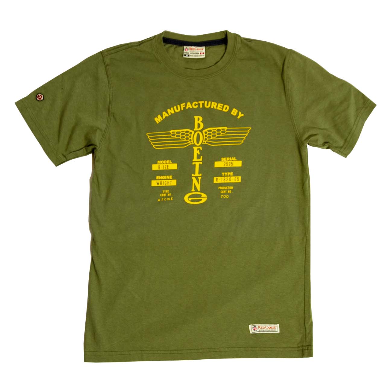 This retro tee from The Boeing Store is a green, 100% cotton shirt featuring a yellow graphic with Manufactured by BEING and wings, plus small text and symbols. A label enhances the bottom hem.