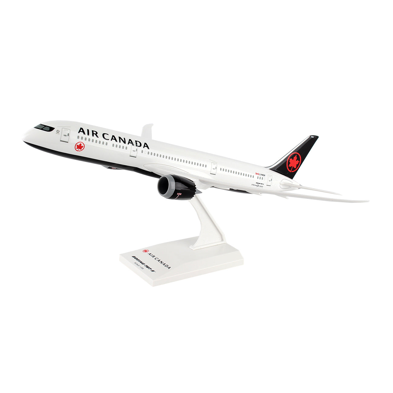 The Daron Air Canada Boeing 787-9 2017 1:200 Model features intricate black and white graphics, an Air Canada logo on the tail, and rests on a stand displaying the Air Canada name.