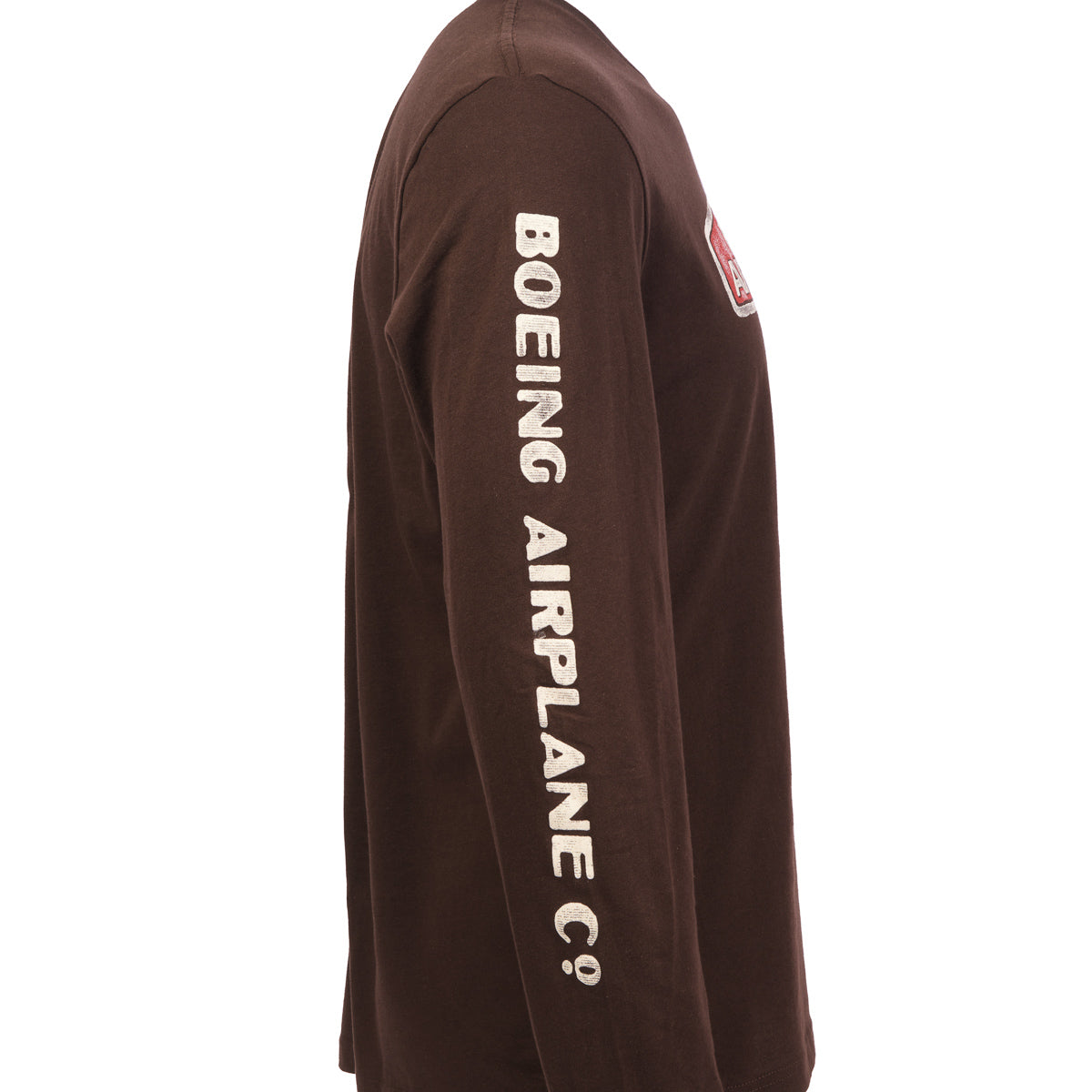 A person wears The Boeing Stores Heritage Mens Long Sleeve T-Shirt, with Boeing Airplane Co. in white text along the sleeve. The side view from shoulder to hip captures its timeless, vintage appeal.