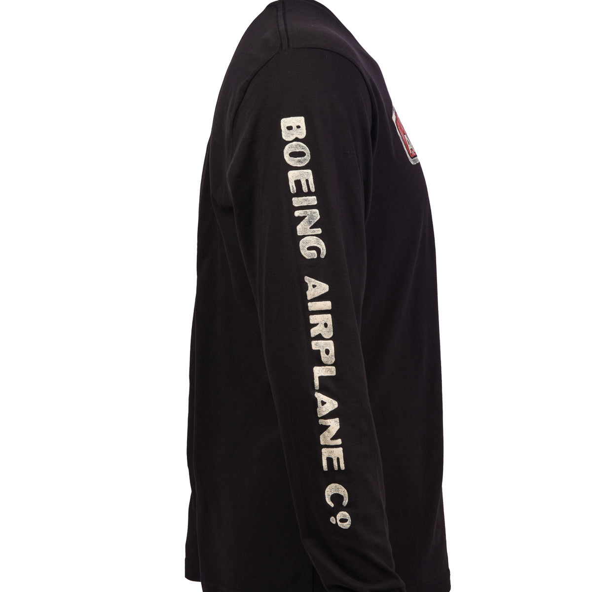 The Boeing Stores Boeing Airplane Co. Heritage Mens Long Sleeve T-Shirt features BOEING AIRPLANE CO. in bold white letters along the sleeve, exuding a vintage vibe with a small chest patch that blends classic and modern styles.