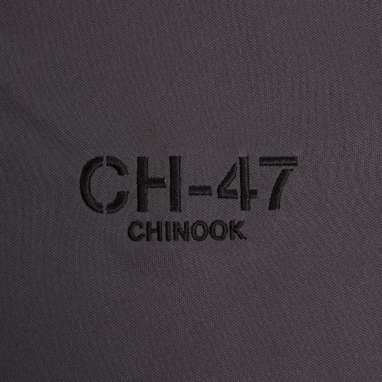 Close-up of black embroidery on dark gray showcases CH-47 CHINOOK, honoring Boeings legendary helicopter. Available as the Boeing CH-47 Polo by The Boeing Store.