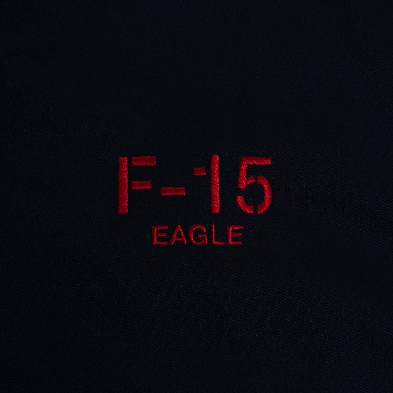 Text on a dark background reads Boeing F-15 Polo in red, reminiscent of the aircrafts legendary prowess, from The Boeing Store.
