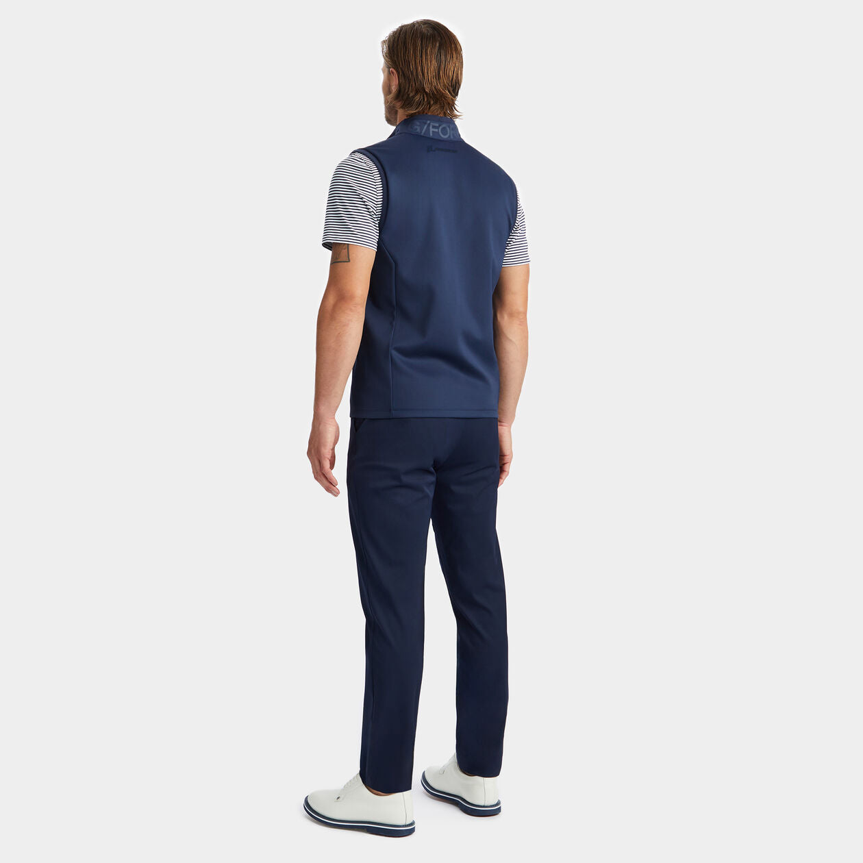 Full body backside product lifestyle image on a male model.