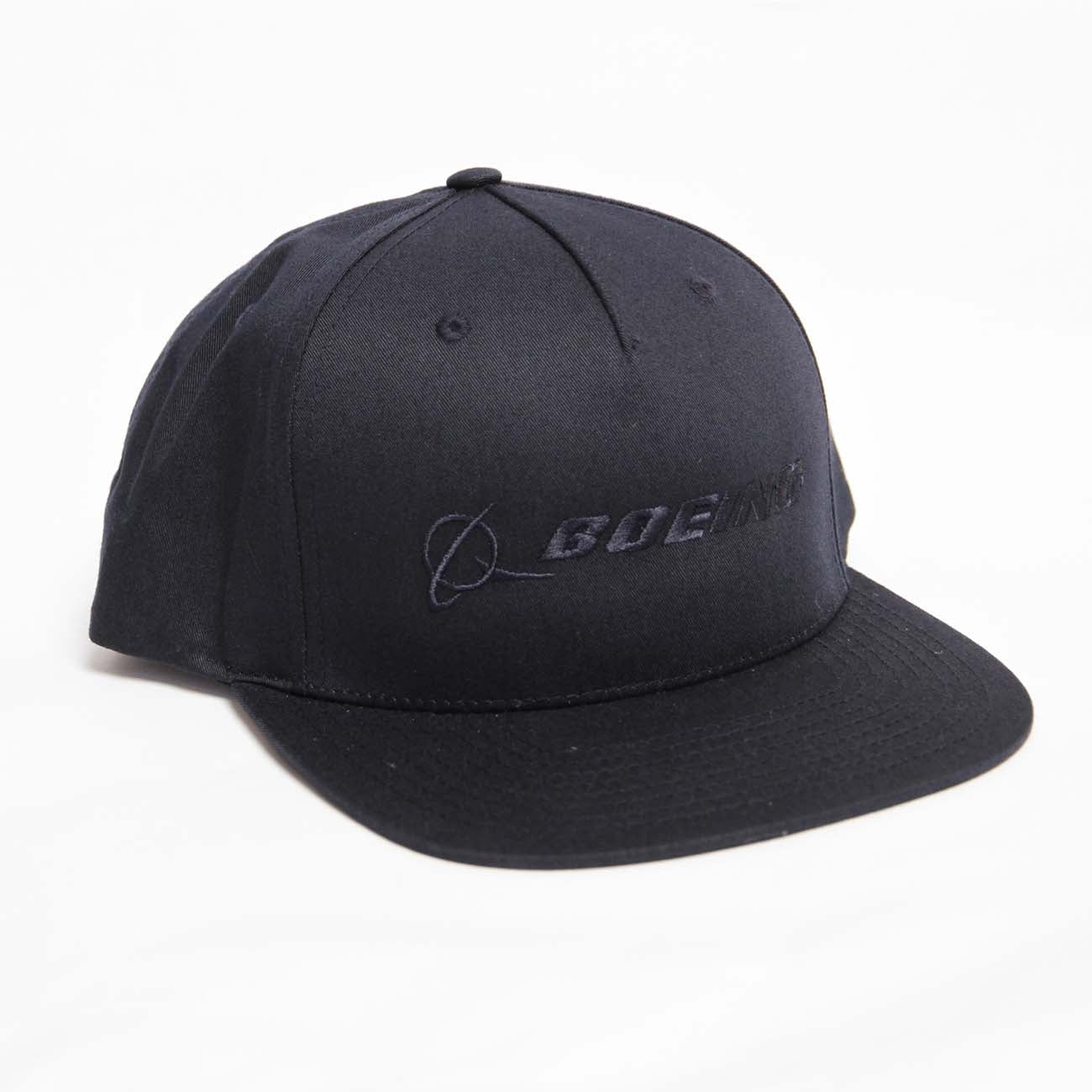 The Richardson Boeing Signature Logo Flat Bill Hat by The Boeing Store is a black cap with a flat bill. It features the black embroidered Boeing logo on a white background at the front and includes a snapback closure for adjustable fit.