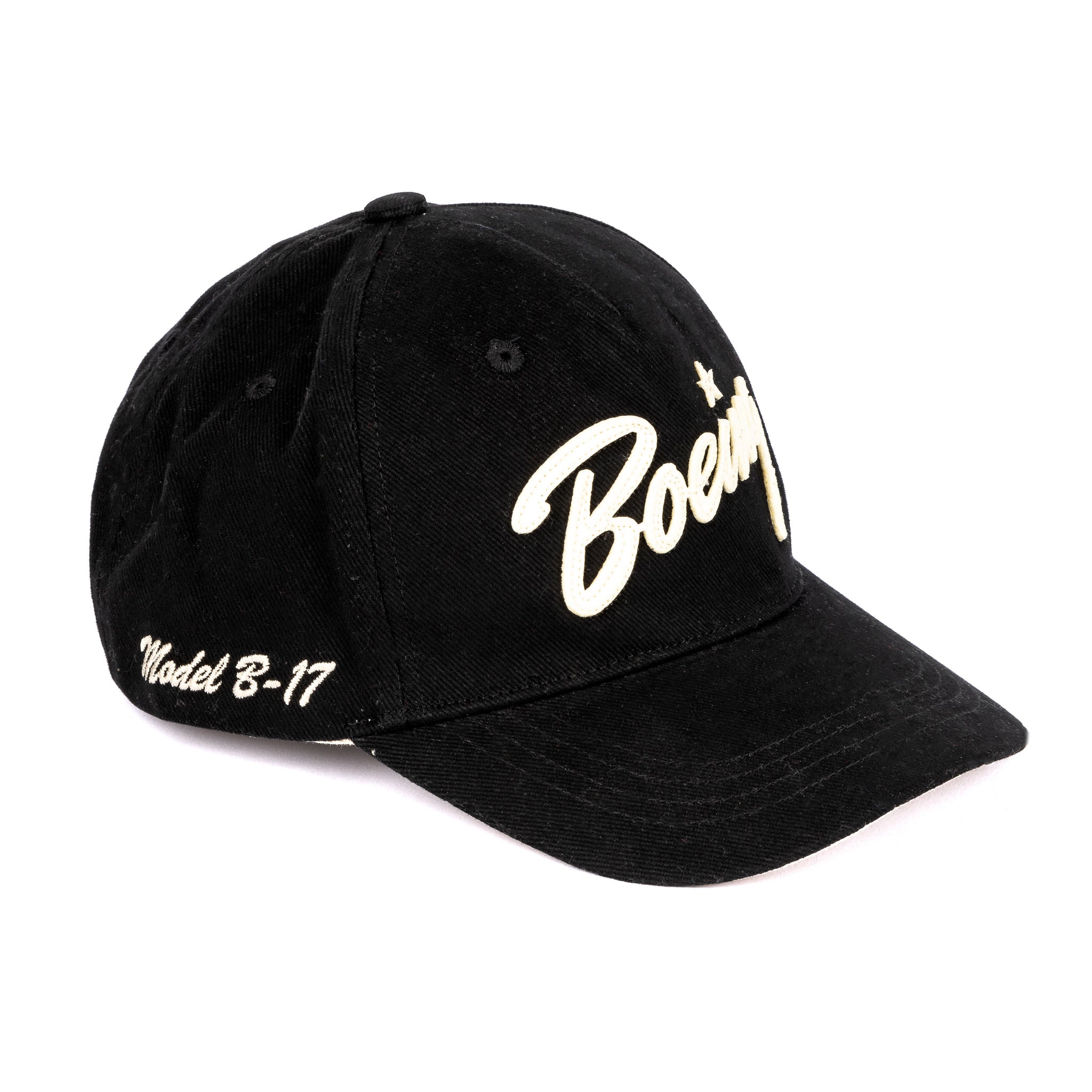 The Boeing Stores Red Canoe Boeing B-17 Script Hat is a black cotton twill cap featuring large white “Boeing” script on the front and “Model B-17” embroidered in white on the brim’s side.