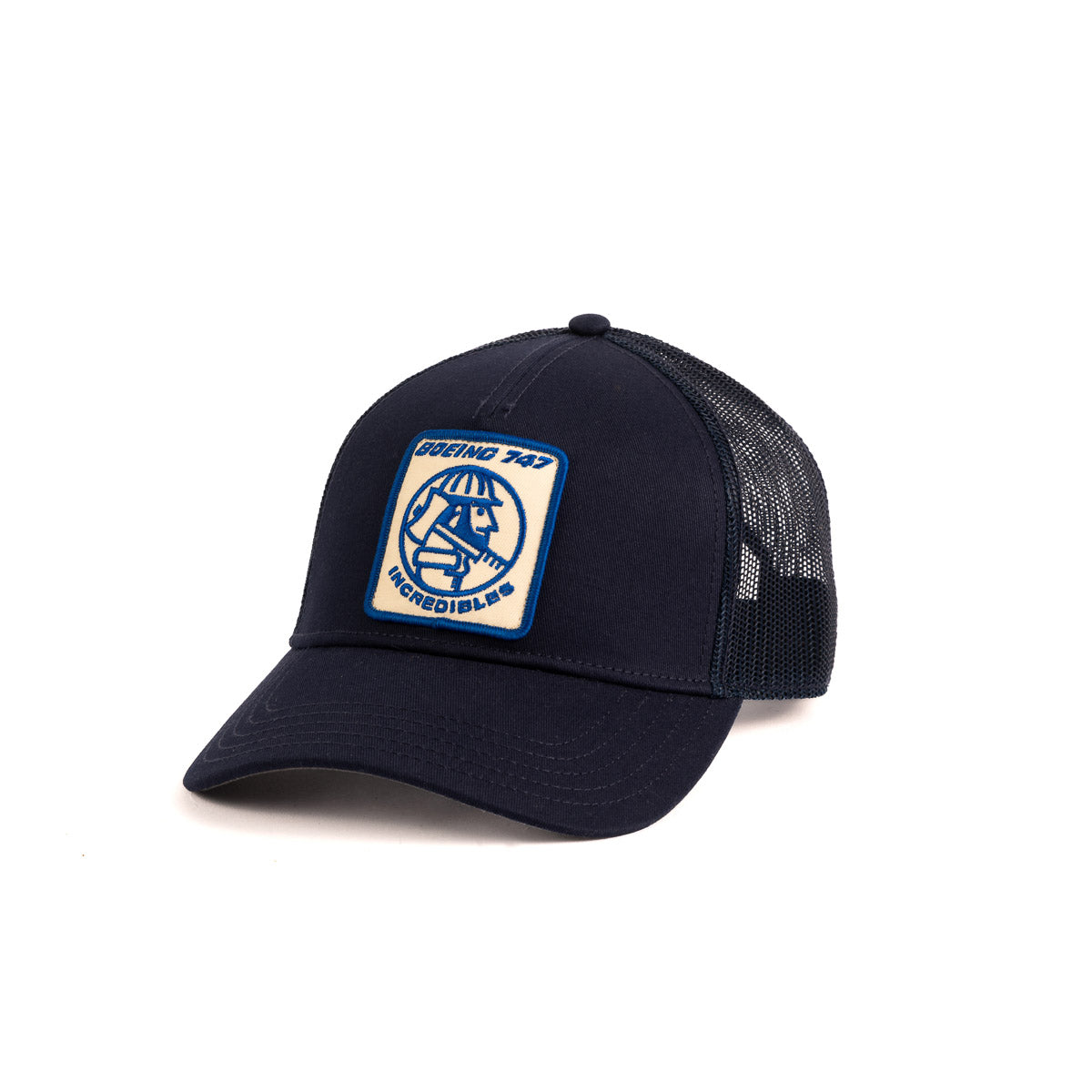 The Boeing Stores Boeing Vintage 747 Incredibles Hat is a black trucker cap with a mesh back, featuring a vintage logo patch on the front. The blue and white patch reads INCLUDES… SESSIONS 1234, capturing the essence of Boeing 747 Incredibles.