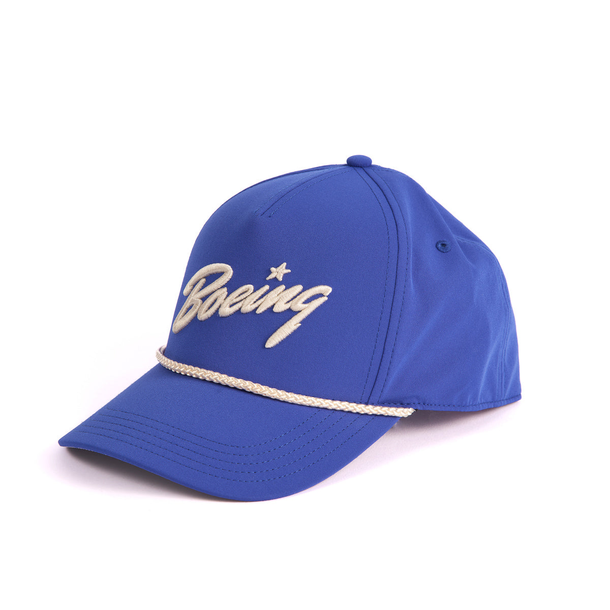 The Boeing Stores Boeing 5 Panel Nylon Hat is a blue cap with the white Boeing script logo on the front, a white nylon cord across the crown base, and an adjustable snap back for a perfect fit, showcased on a plain white background.
