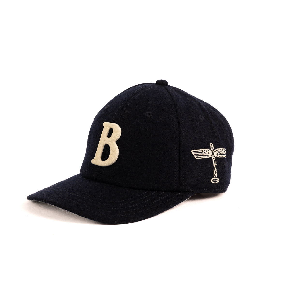 The Boeing Stores unisex black baseball cap, named the Boeing Felt B Hat, features a prominent white felt B and a side winged logo with BOLLING, evoking Boeing Airplane design elements. Elegantly displayed on a white background, it embodies style and sophistication.
