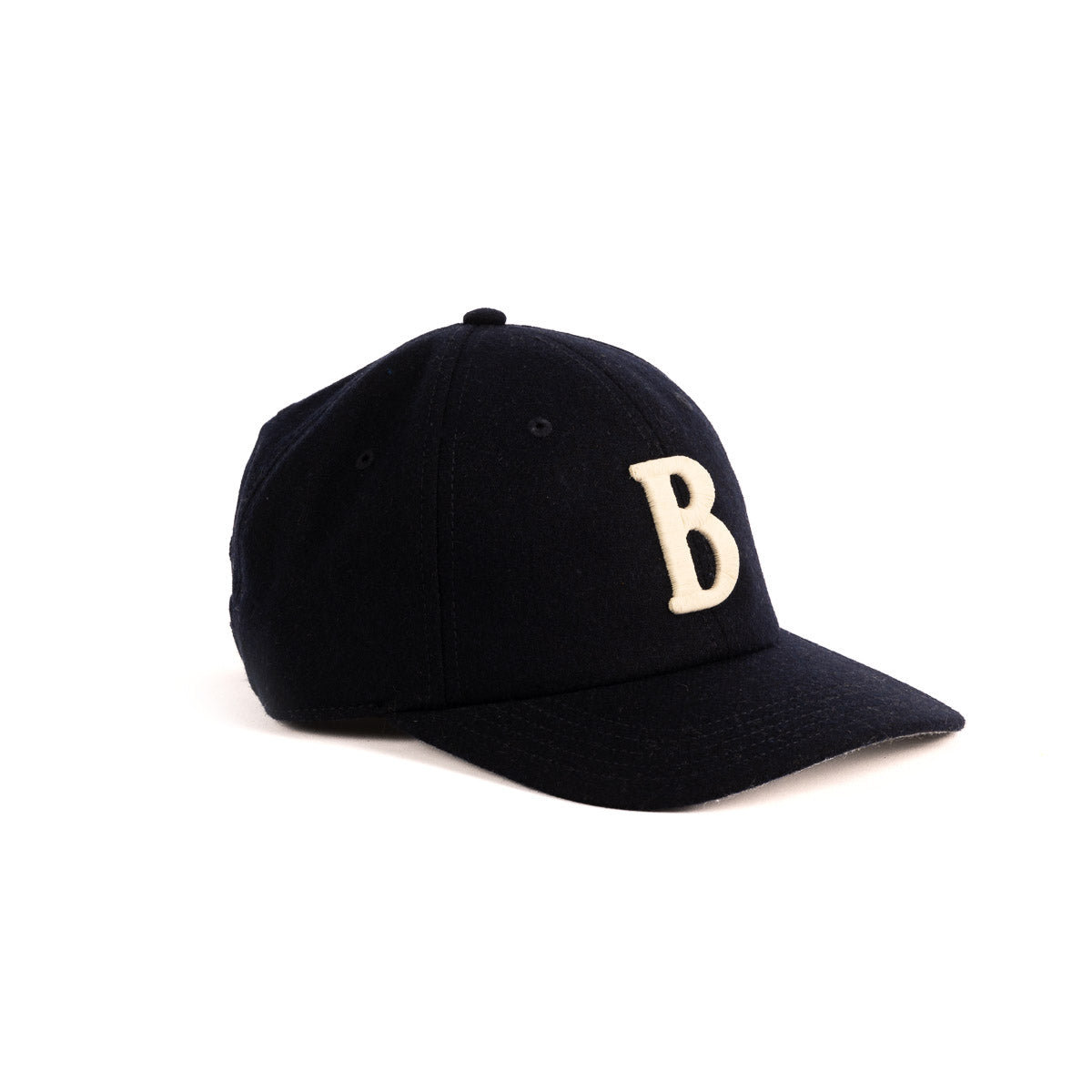 The Boeing Stores Boeing Felt B Hat is a black unisex cap with a curved brim featuring a large white felt letter B on the front. Styled at an angle on a white background, its ideal for any Boeing Airplane enthusiast.