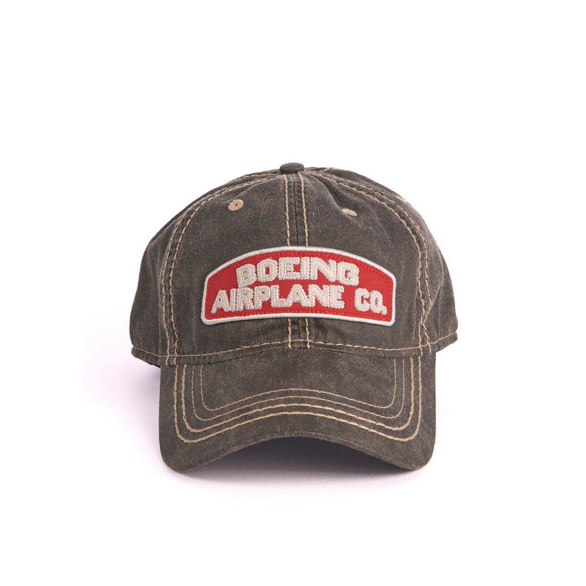 The Boeing Stores Boeing Airplane Co. Heritage Hat is an olive-green cap with visible stitching and an embroidered red patch displaying BOEING AIRPLANE CO. in white. It features an adjustable velcro strap for comfort.