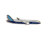 The Boeing Stores Boeing 787 Illustrated Magnet features a blue and white Dreamliner with logos on the side, finished in enamel color, shown from a side view against a white background.
