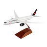 The Daron Air Canada Boeing 787-9 1:200 Model features Air Canada livery, a detailed logo, and comes mounted on a brown wooden stand—ideal for collectors and display.