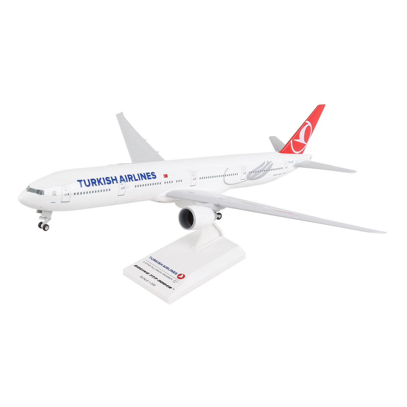 The Daron Turkish Airlines Boeing 777-300ER 1:200 Model features a white body, red tail with the airline’s logo, and comes with a display stand. Made from injection molded plastic, it closely resembles the real commercial jet.